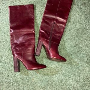 Knee-high Tory Burch leather boots.